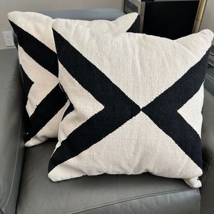 2 black and white throw pillows